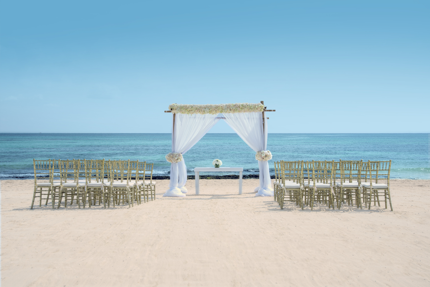 Elegant Beach Wedding Ceremony Setup with Chairs