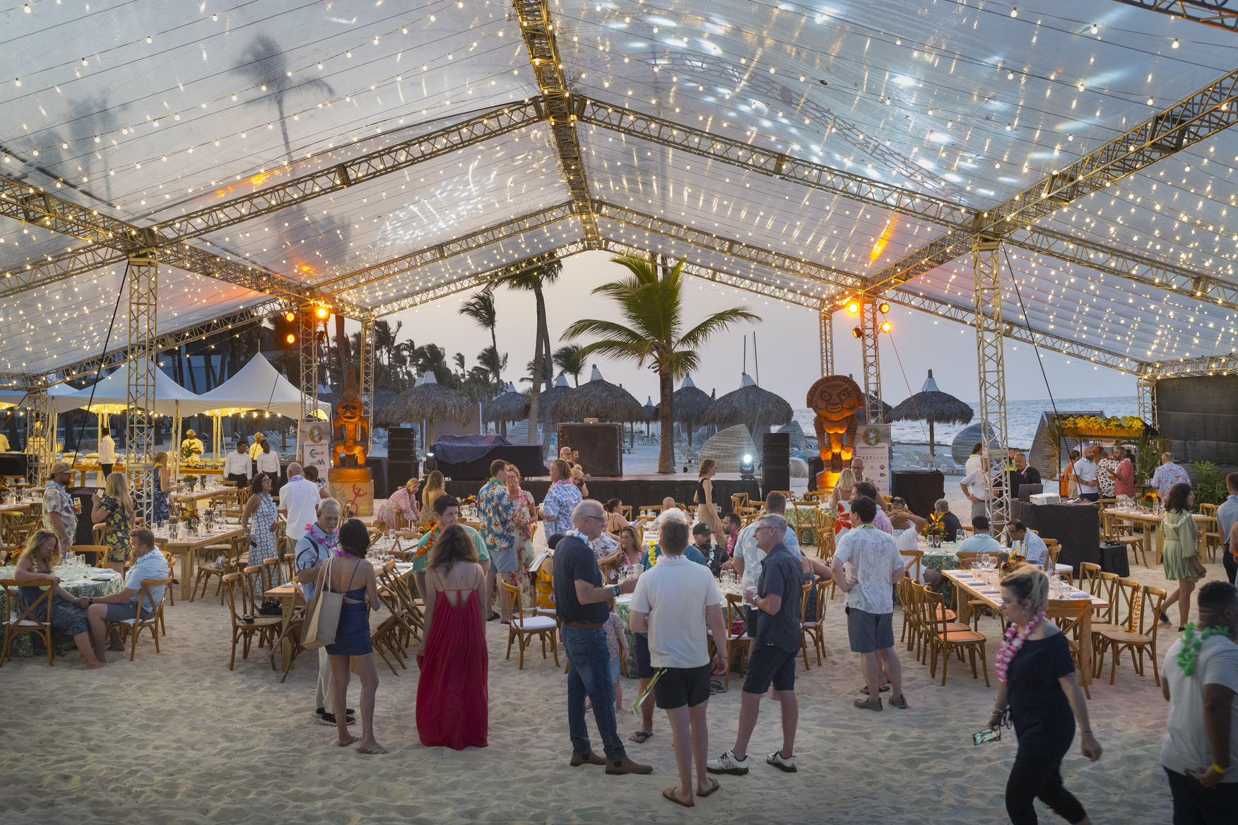 Evening Beach Party Under Canopy With String Lights