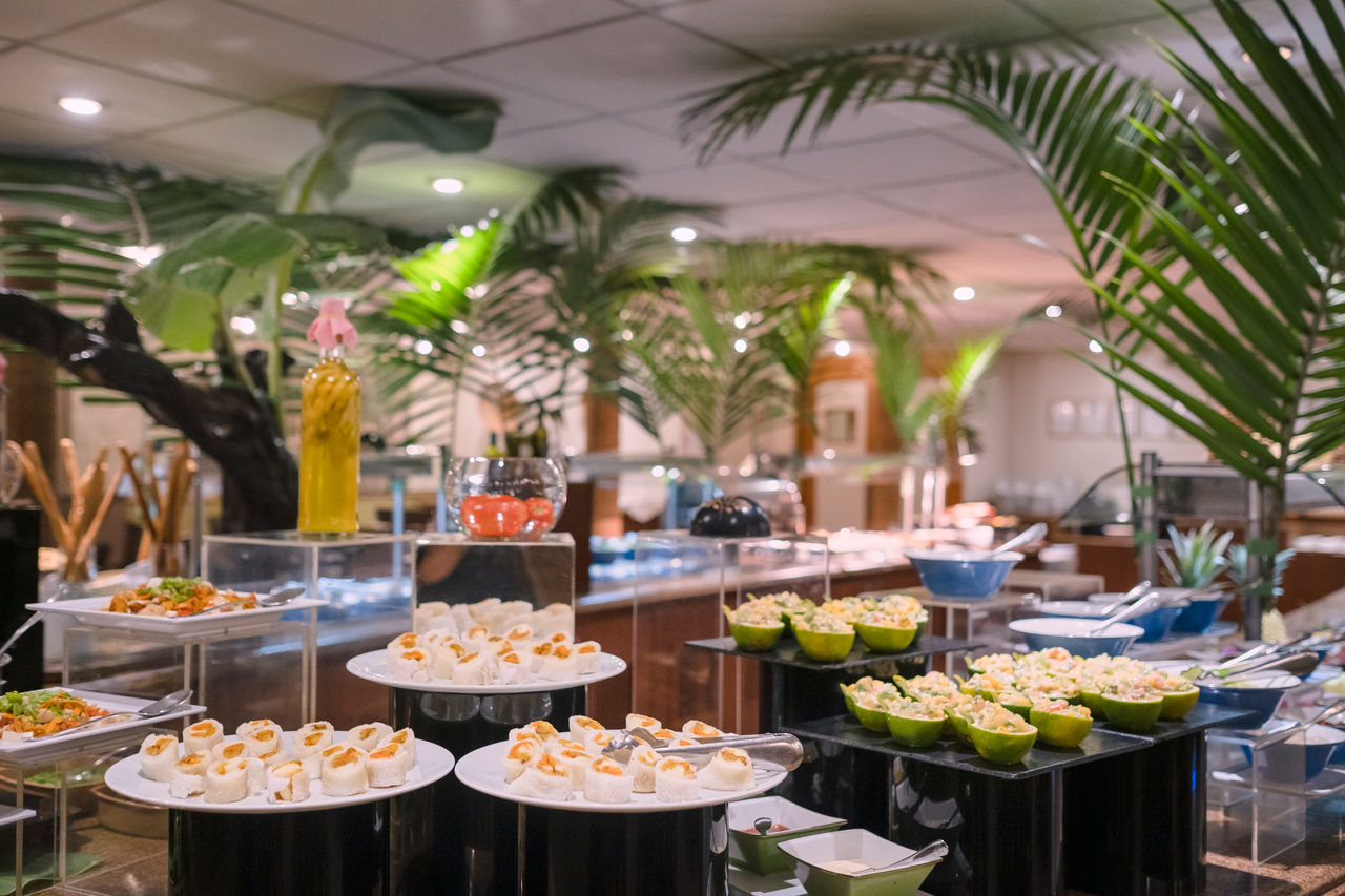 Elegant buffet spread in tropical restaurant setting